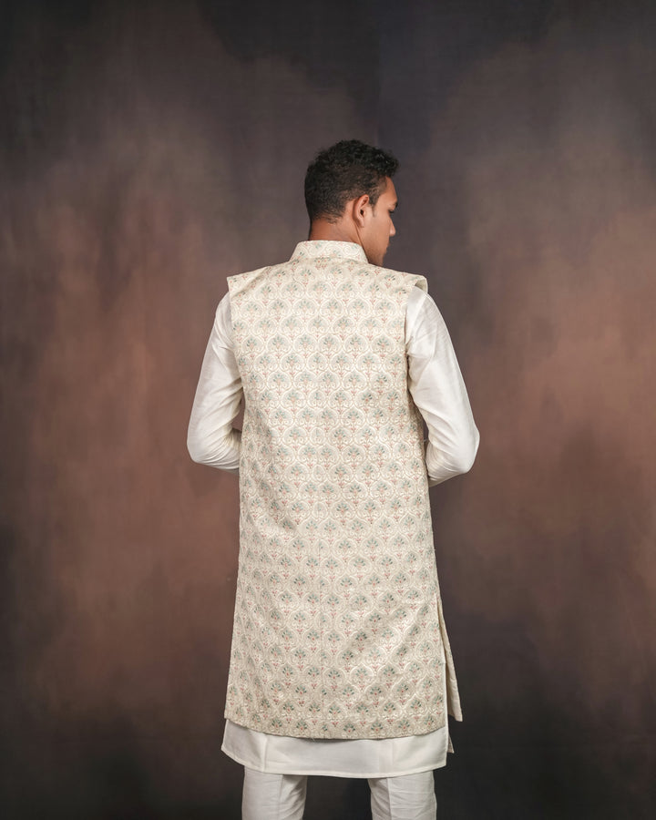 Cream long koti set showcasing intricate embroidery details