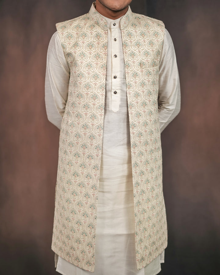 Cream long koti set showcasing intricate embroidery details