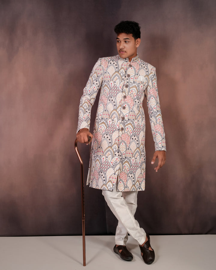 Luxe men’s white velvet Indo-Western outfit with vibrant multi-colored embroidery, designed for grand occasions and special events.