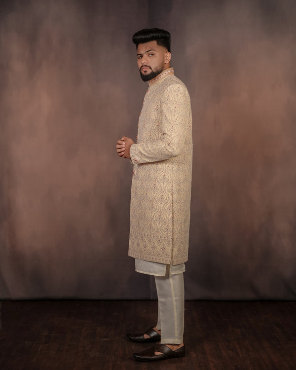 Men’s golden Indo-Western fashion statement with a striking hue and detailed craftsmanship, ideal for elegant occasions.