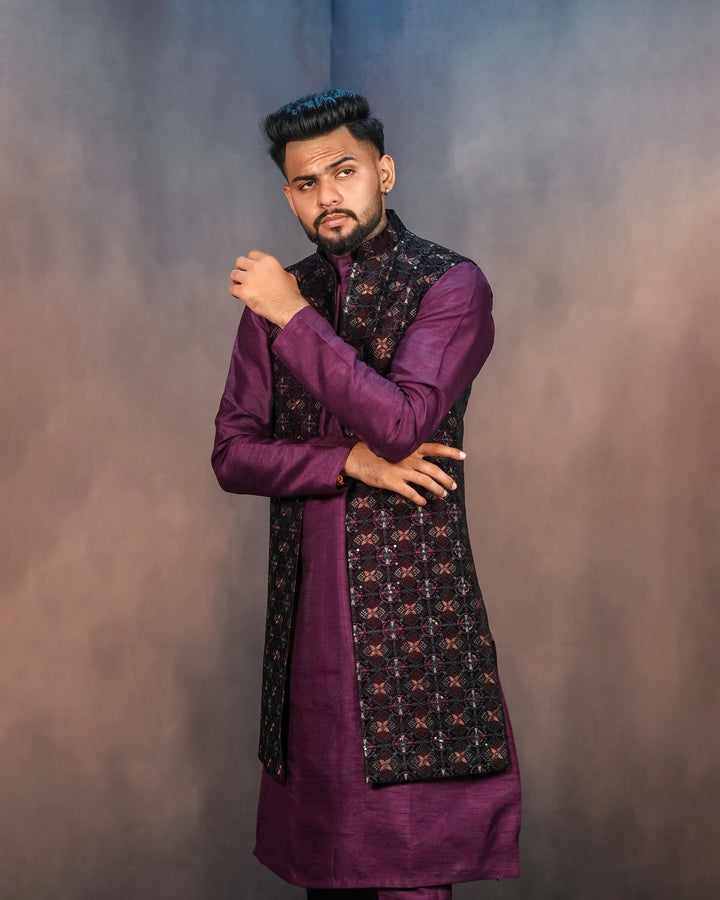 A graceful purple long jacket outfit with intricate embroidery and matching trousers.