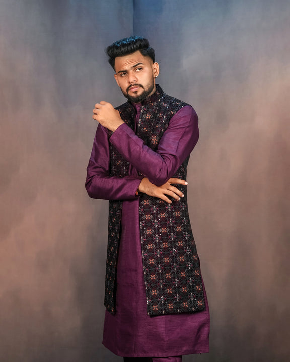 A graceful purple long jacket outfit with intricate embroidery and matching trousers.