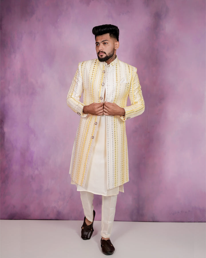 A men's traditional yellow mirror work Three-Piece Indo-Western attire