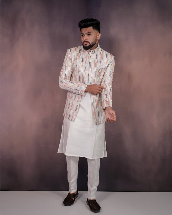 Cream Jodhpuri outfit with intricate multicolored embroidery, perfect for formal events and celebrations.